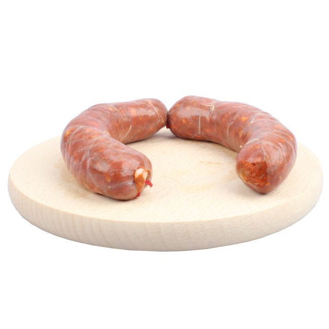 Salsiccia fresca lucana di Corleto Perticara dal colore rosato e dal profumo intenso di finocchietto e peperone, prodotta secondo le antiche tradizioni contadine della Basilicata.
