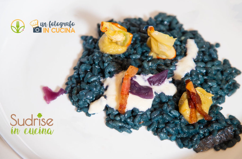 Risotto "blu" con crema di melanzana rossa di Rotonda, guanciale di maialino nero e fonduta di taleggio