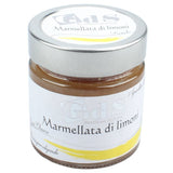 Vasetto di marmellata artigianale di limoni con scorze tagliate a mano, poco zucchero e agrumi biologici coltivati nel Sud Italia. Prodotto Biologico Lucano